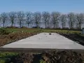 Betonnen funderingsplaat tijdens de bouw van Trimaarzate